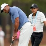 Tiger Woods receives help from his son during US Open practice